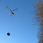 Transporting material with the aid of a helicopter.