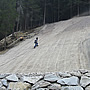 Restoring green area with pre-seeded turf on the rock walls.