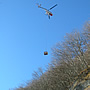 Transporting material with the aid of a helicopter.